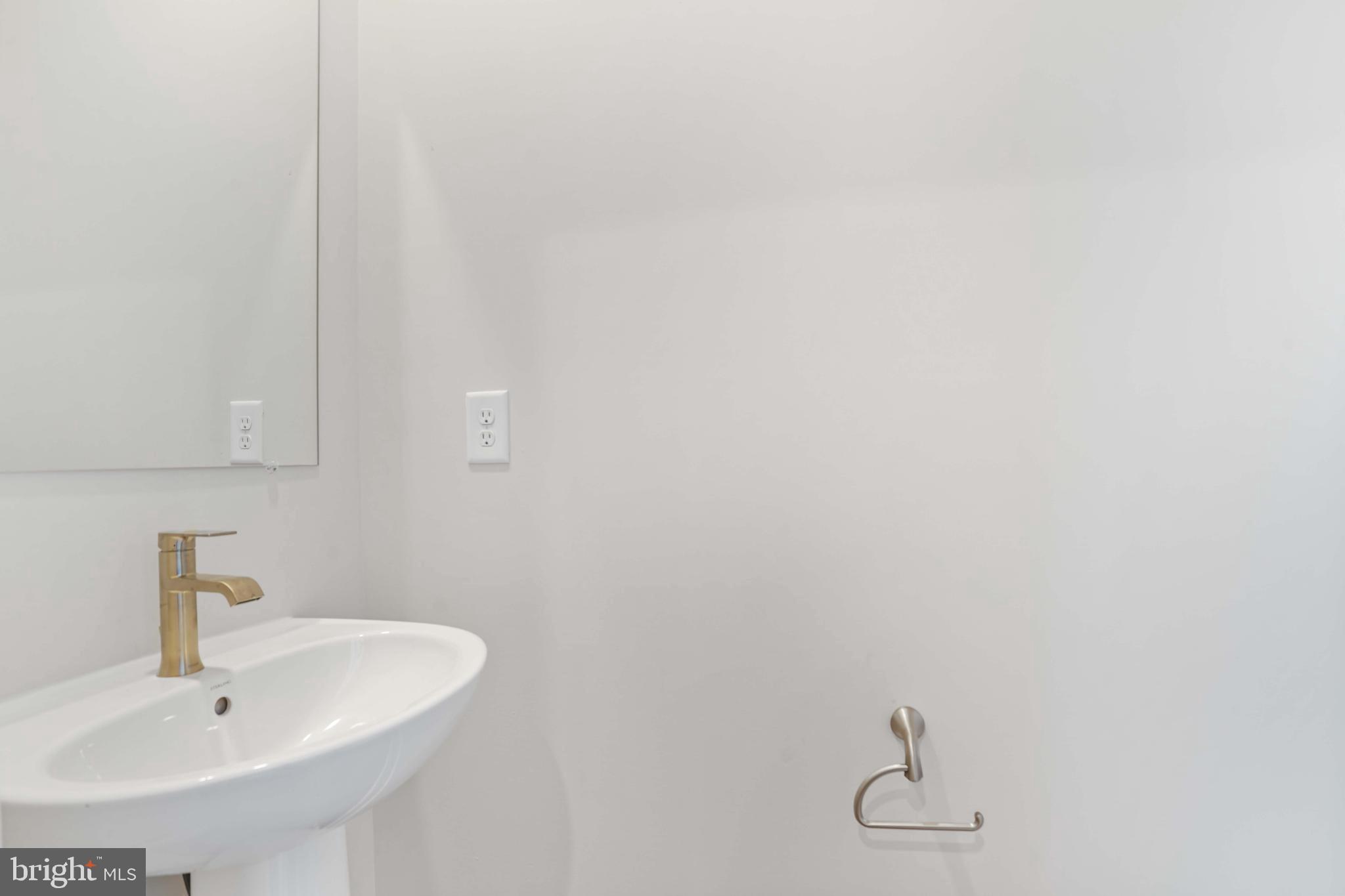 252 Waterstone Road Essex, MD 21221 - Photo 15 of 35 a bathroom with a sink and mirror