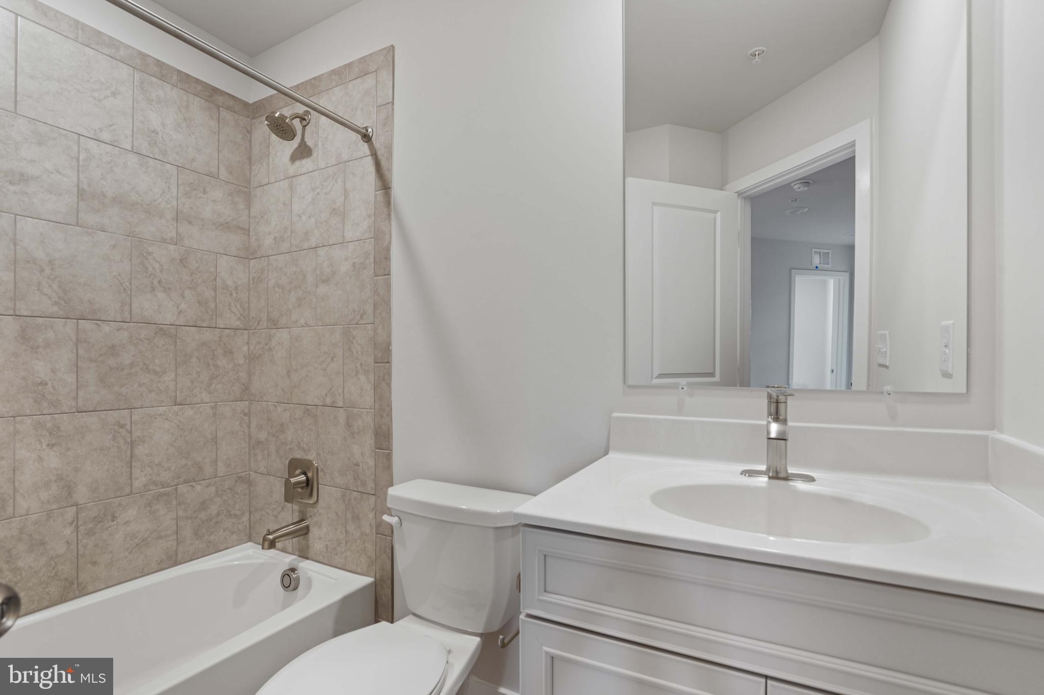 252 Waterstone Road Essex, MD 21221 - Photo 18 of 35 a bathroom with a sink a toilet and a bathtub