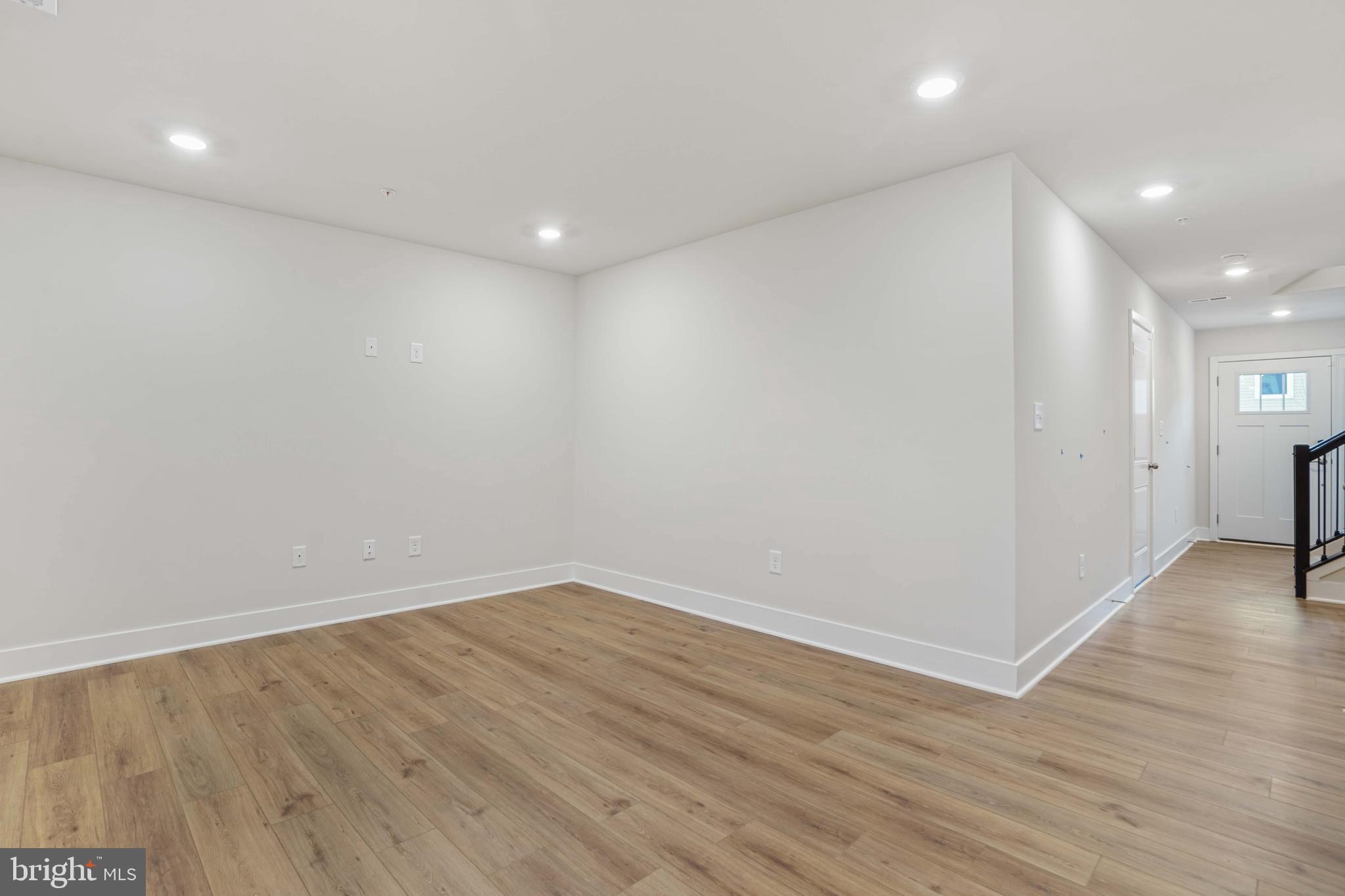252 Waterstone Road Essex, MD 21221 - Photo 27 of 35 an empty room with wooden floor
