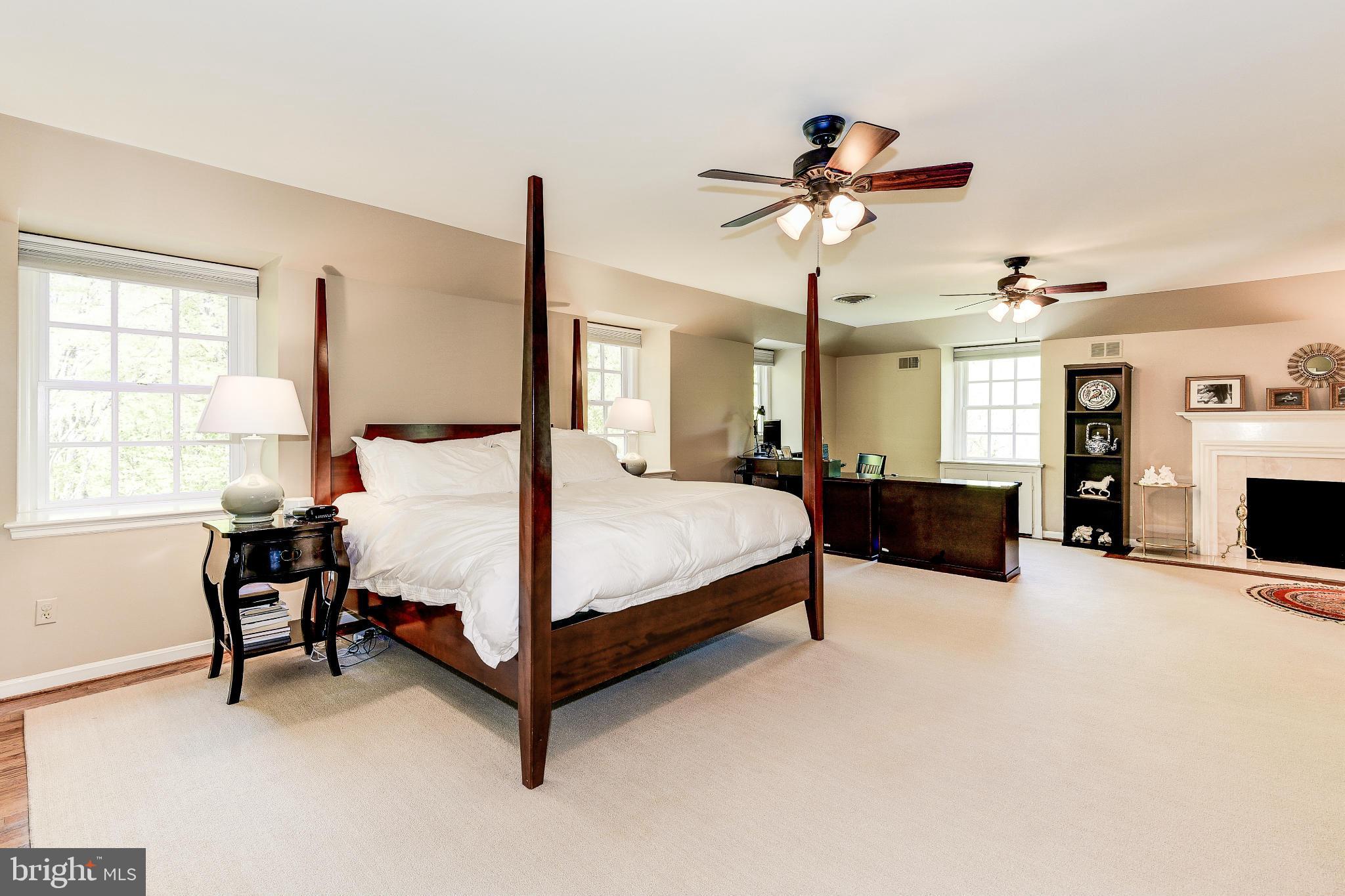 11109 Cripplegate Road Potomac, MD 20854 - Photo 13 of 31 a bed room with a bed and a chandelier