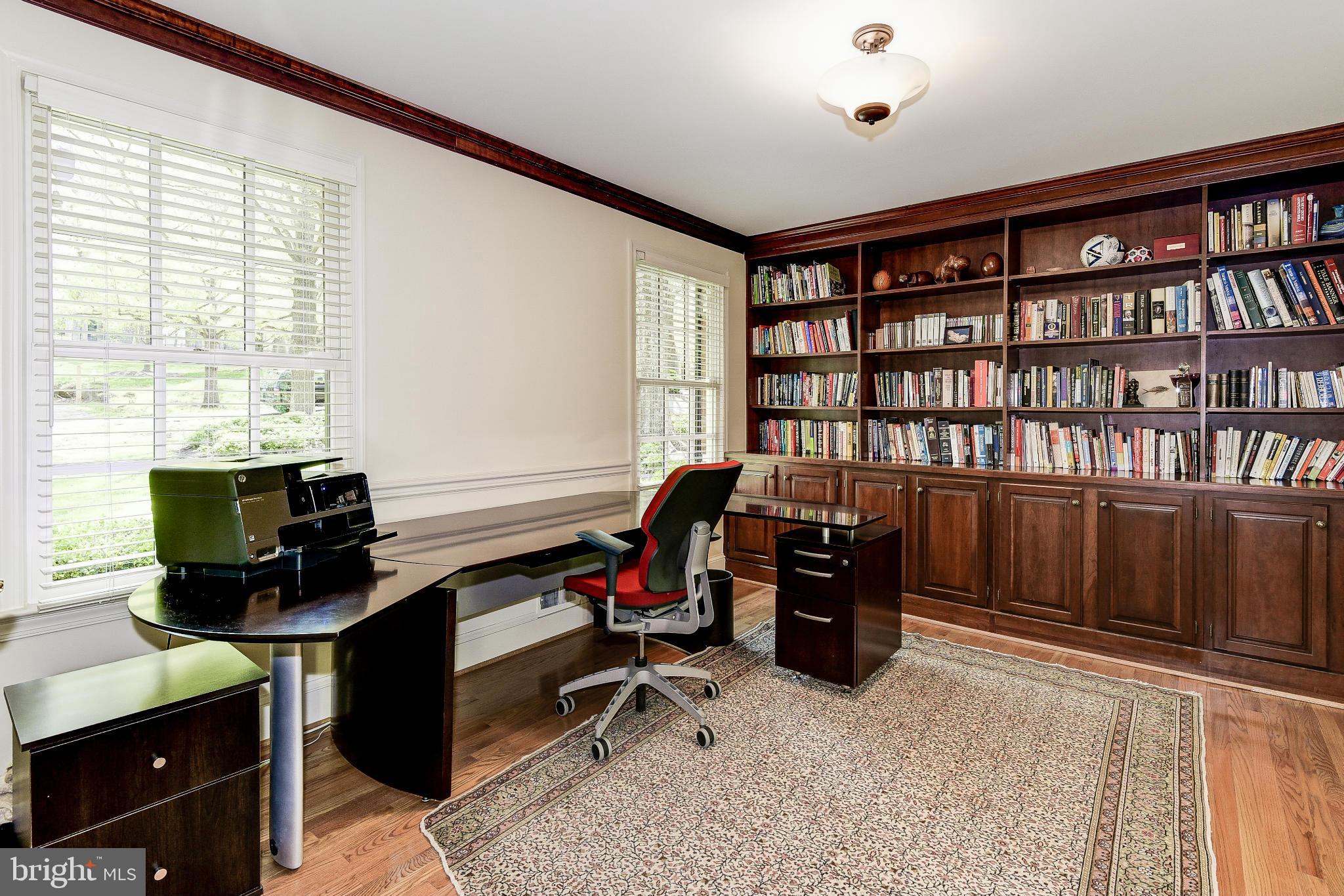 11109 Cripplegate Road Potomac, MD 20854 - Photo 3 of 31 a view of a workspace with furniture and a window