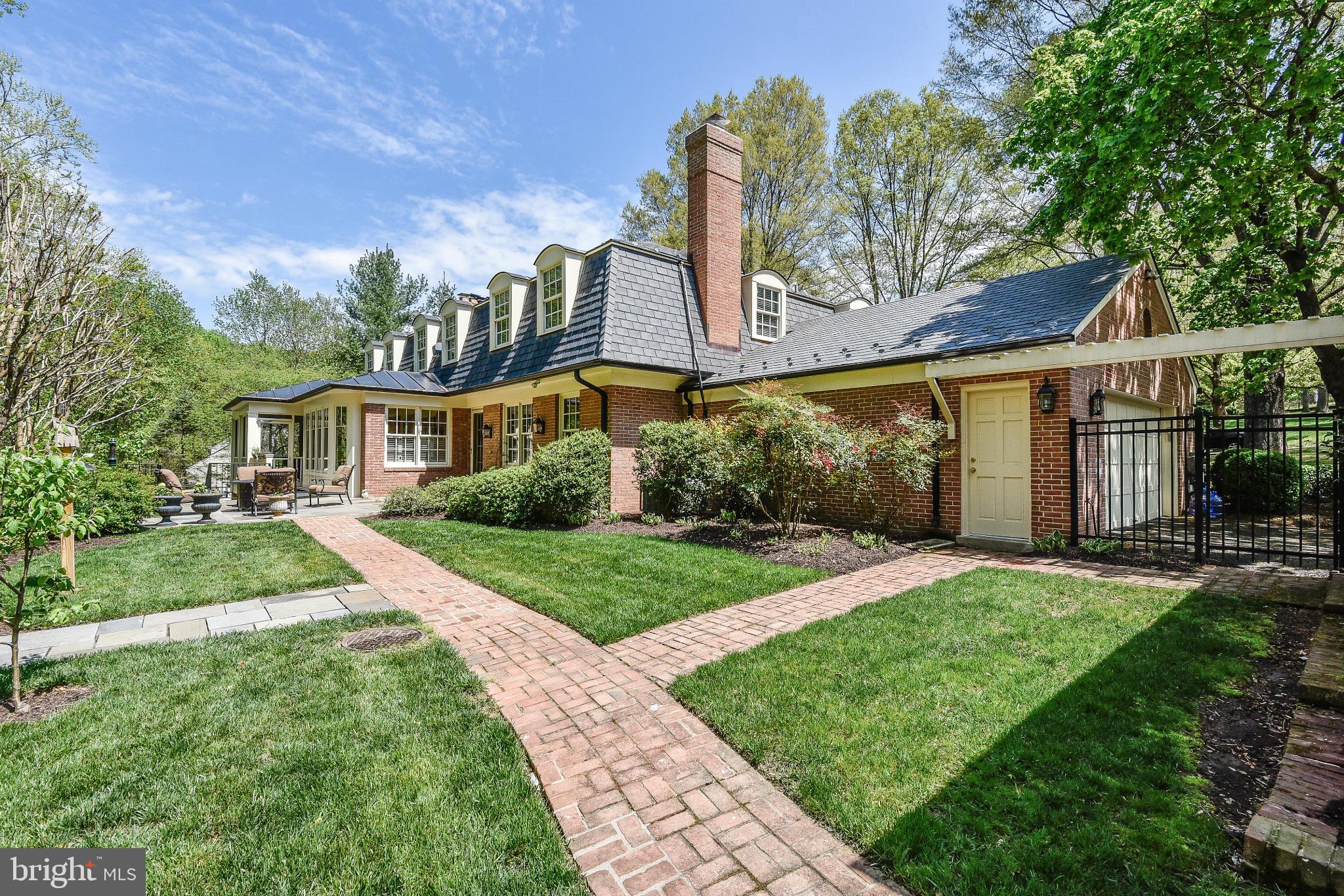 11109 Cripplegate Road Potomac, MD 20854 - Photo 21 of 31 a front view of a house with a yard and garage