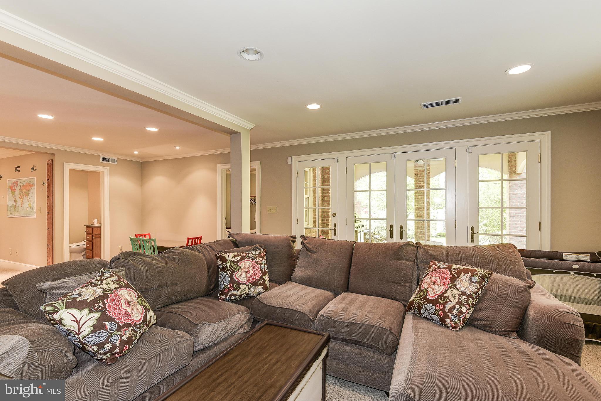 11109 Cripplegate Road Potomac, MD 20854 - Photo 24 of 31 a living room with furniture and a large window