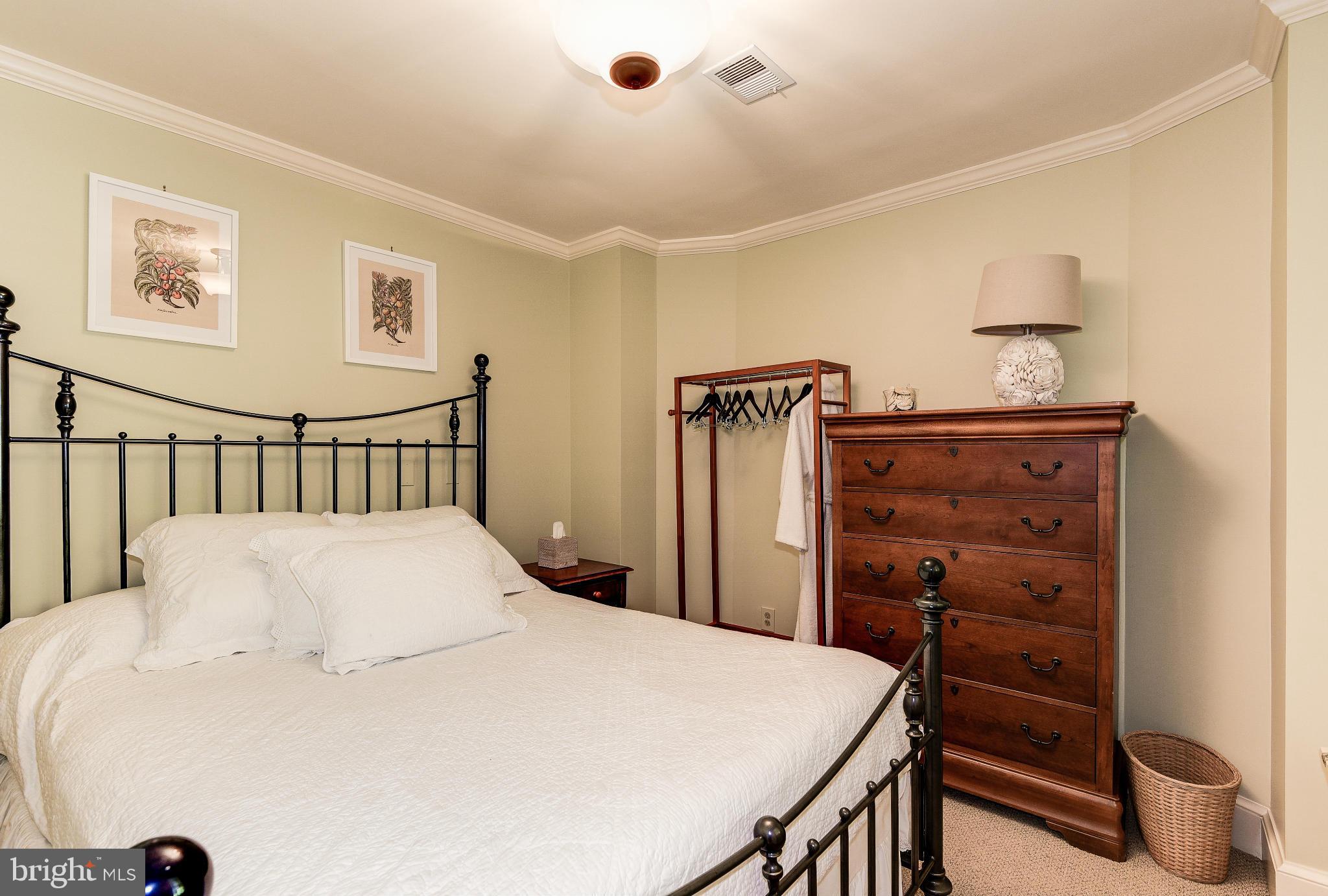 11109 Cripplegate Road Potomac, MD 20854 - Photo 25 of 31 a bedroom with a bed and a dresser