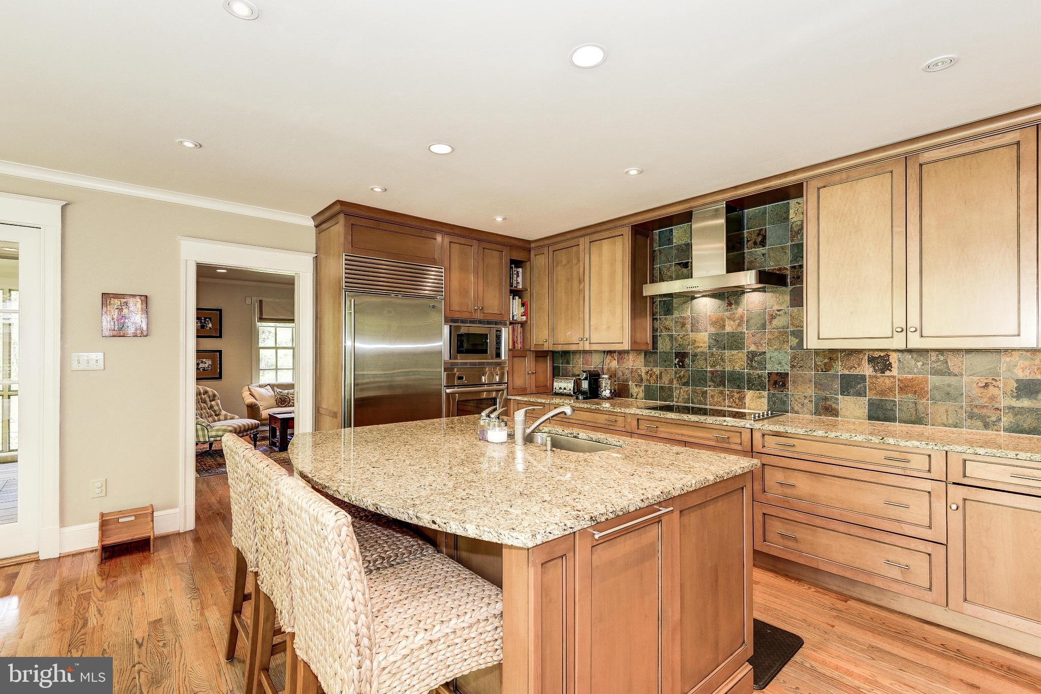 11109 Cripplegate Road Potomac, MD 20854 - Photo 5 of 31 a kitchen with granite countertop a sink stove and refrigerator