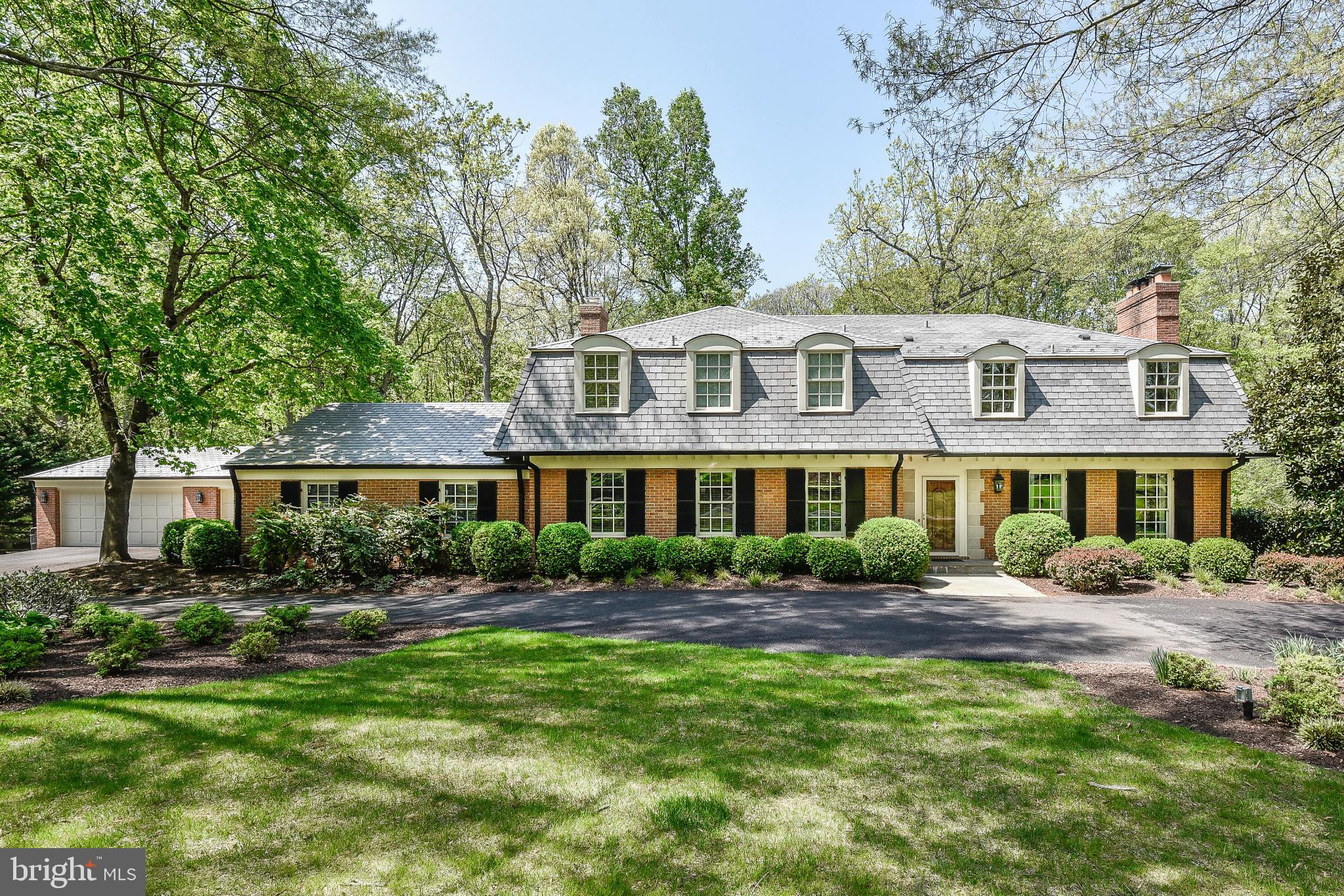 11109 Cripplegate Road Potomac, MD 20854 - Photo 10 of 31 a front view of a house with a garden
