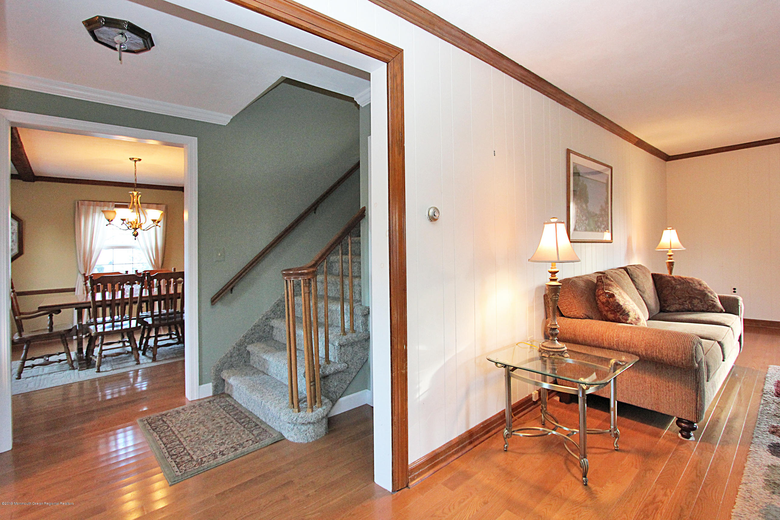 134 Ravine Drive Matawan, NJ 07747 - Photo 5 of 23 Living Room to Hall & Dining Room