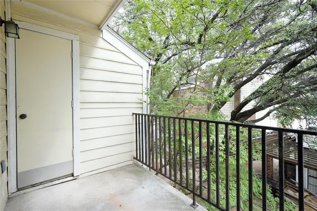 a view of a balcony with an outdoor space