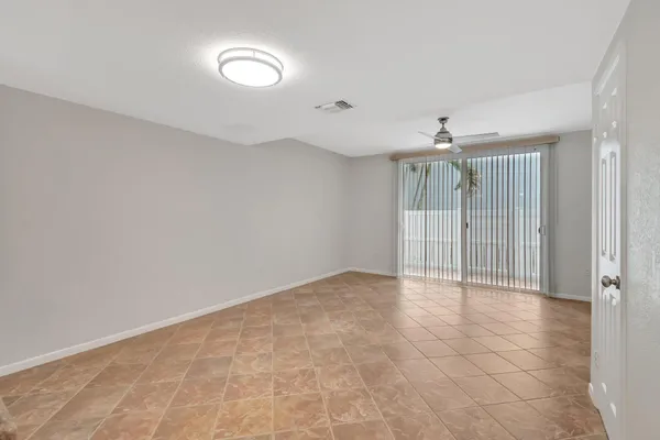 a view of an empty room with a fan