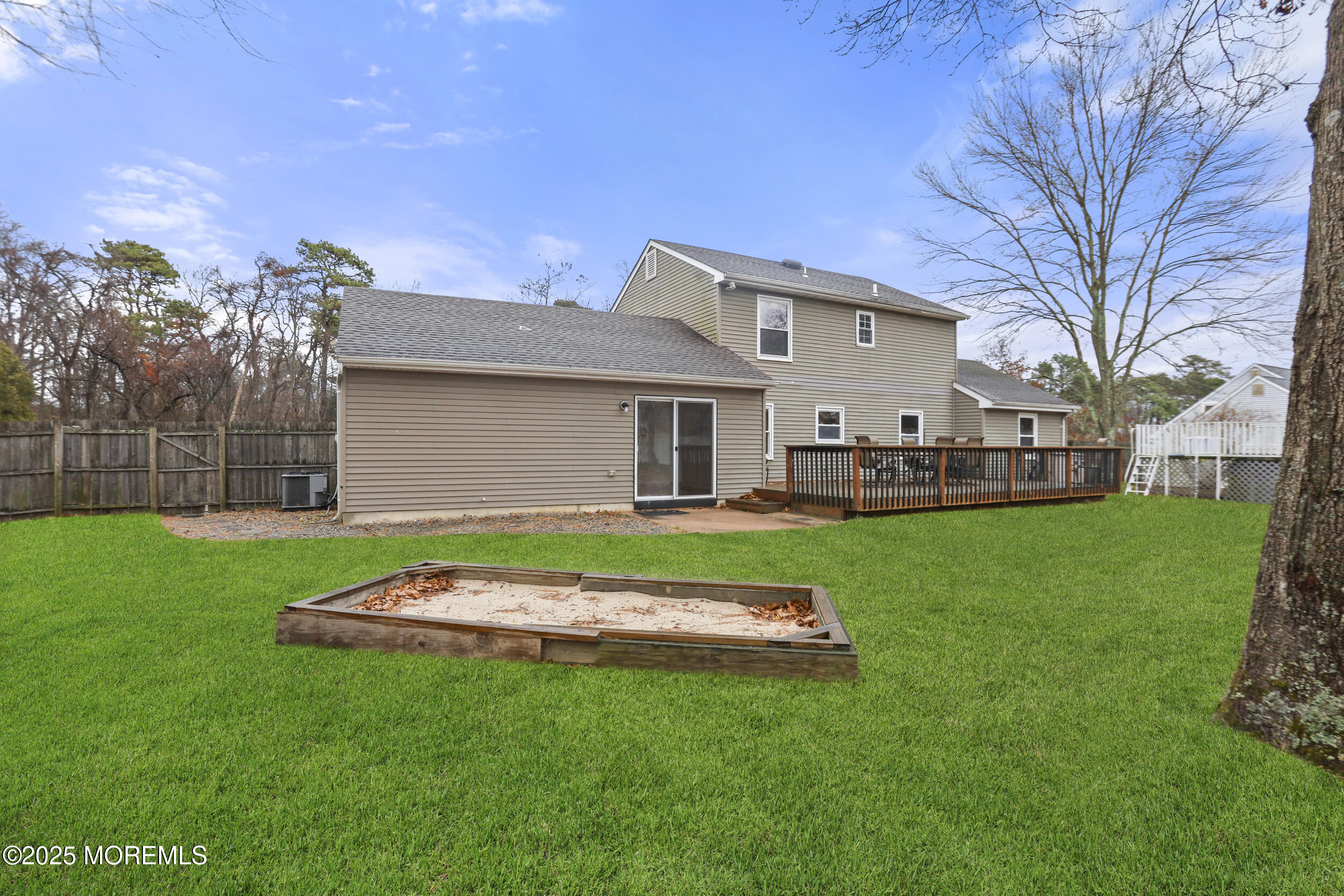 556 Kirk Lane Brick, NJ 08724 - Photo 14 of 15 a front view of a house with a yard and trees