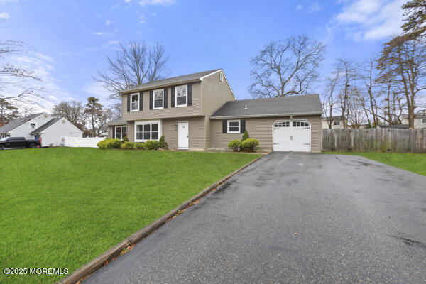 556 Kirk Lane Brick, NJ 08724 - Photo 2 of 15 a front view of a house with a garden