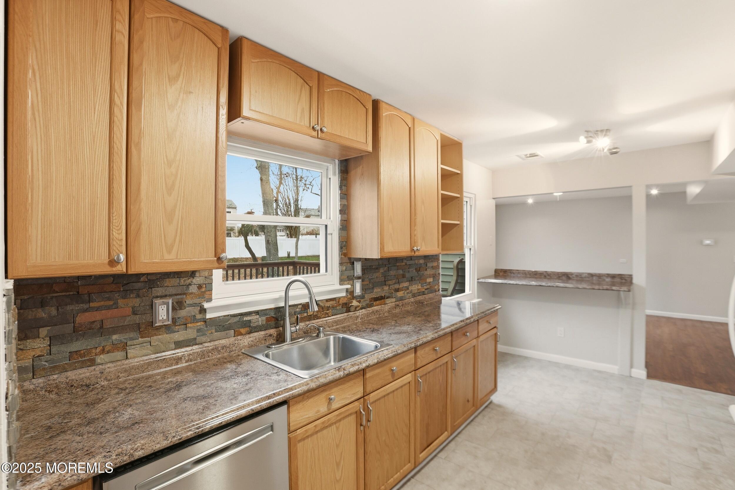 556 Kirk Lane Brick, NJ 08724 - Photo 4 of 15 a kitchen with a sink and cabinets