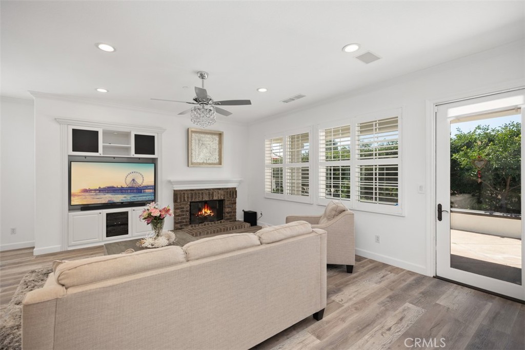 2 Via Paquete San Clemente, CA 92673 - Photo 17 of 44 a living room with furniture a fireplace and a flat screen tv
