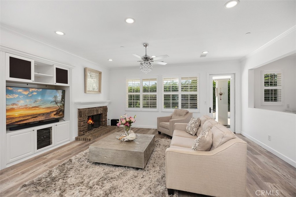 2 Via Paquete San Clemente, CA 92673 - Photo 3 of 44 a living room with furniture a fireplace and a flat screen tv