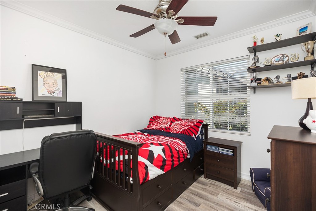 2 Via Paquete San Clemente, CA 92673 - Photo 34 of 44 a bedroom with a bed and a chandelier