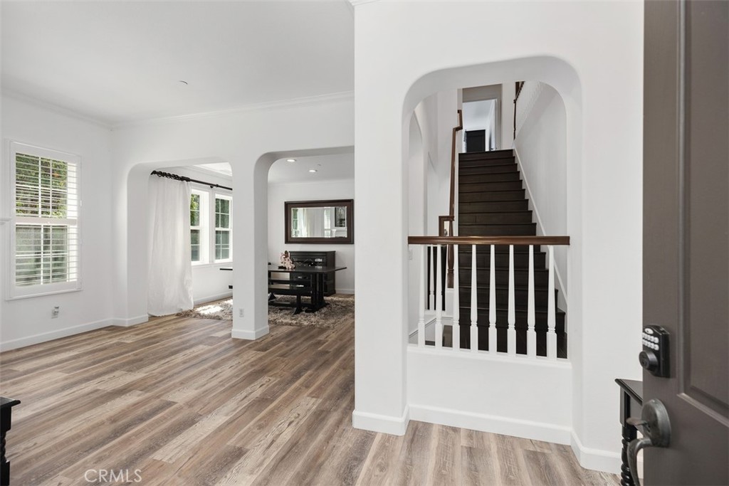 2 Via Paquete San Clemente, CA 92673 - Photo 6 of 44 an entryway of a house with wooden floor and stairs