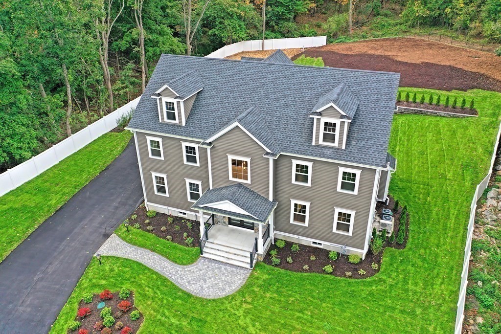 a aerial view of a house with garden