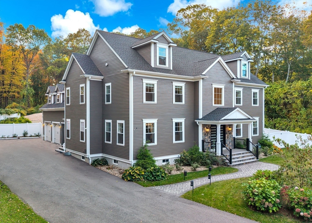 125 Union Street Natick, MA 01760 - Photo 2 of 38 a front view of a house with yard and green space