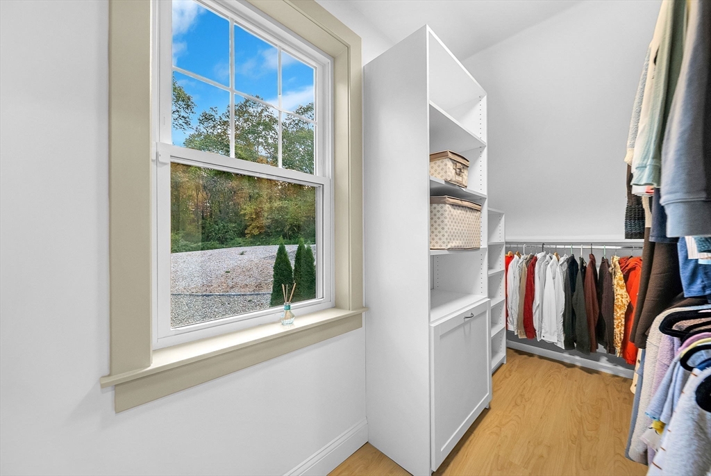 125 Union Street Natick, MA 01760 - Photo 30 of 38 a view of walk in closet with clothes and shoes