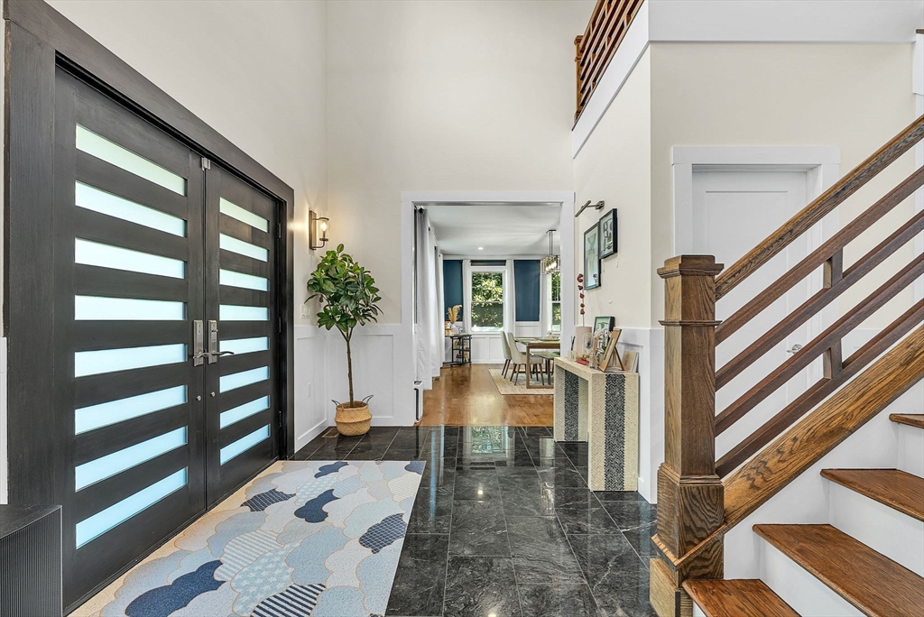 125 Union Street Natick, MA 01760 - Photo 4 of 38 a living room with furniture and a floor to ceiling window