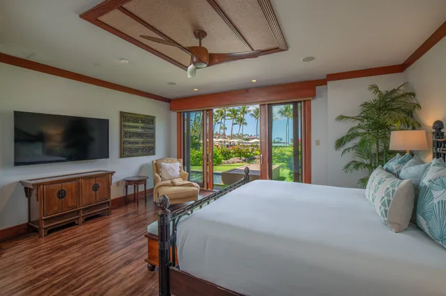 a bathroom with a granite countertop sink a large mirror and a shower