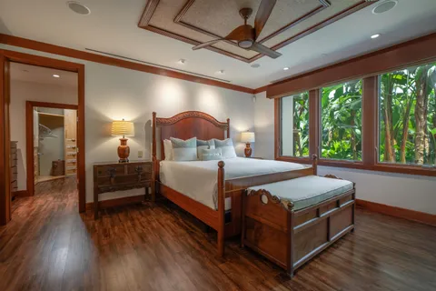 a bathroom with a granite countertop sink a large mirror and a shower