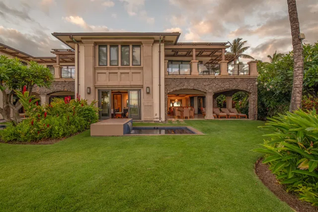 a dining room with furniture a chandelier and window