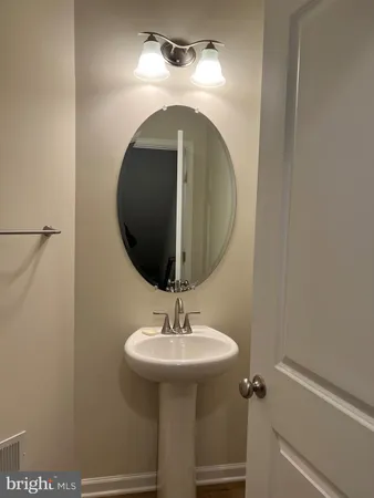 a bathroom with a sink and mirror