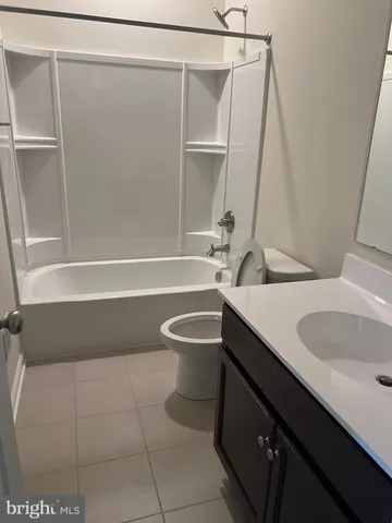 a bathroom with a sink a toilet and a bathtub