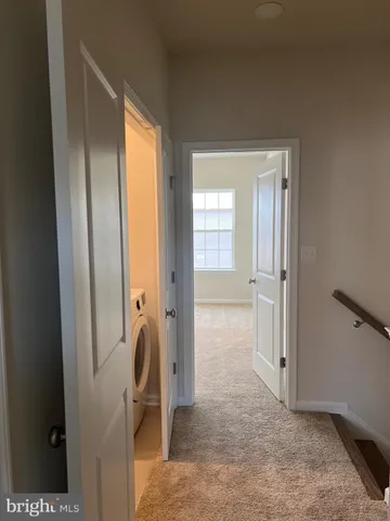 a view of a bathroom with tub and mirror