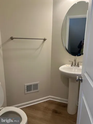 a bathroom with a sink and mirror