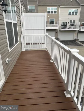 a view of a balcony with wooden floor