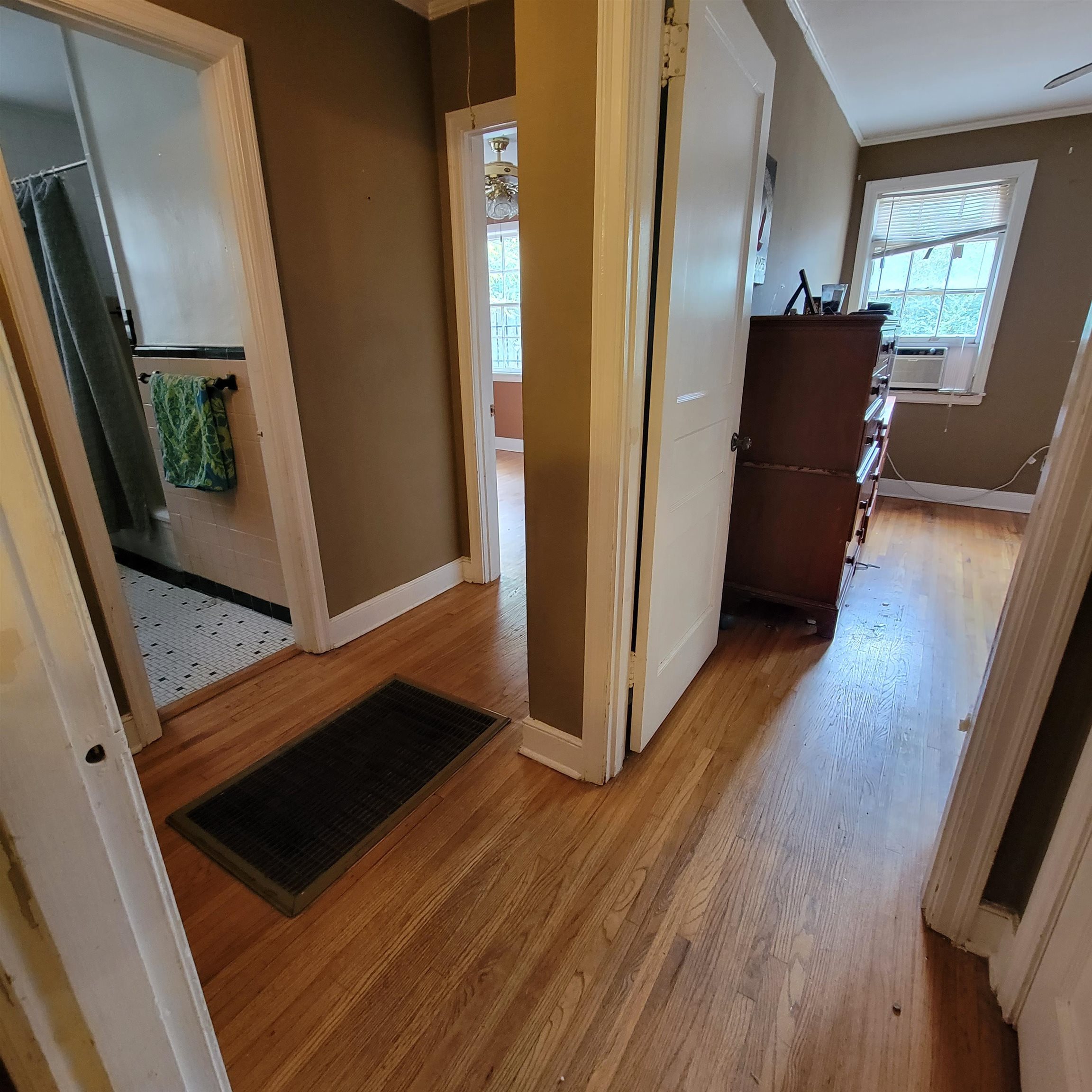 157 Roberta Drive Memphis, TN 38112 - Photo 10 of 25 a view of a hallway with wooden floor and stairs