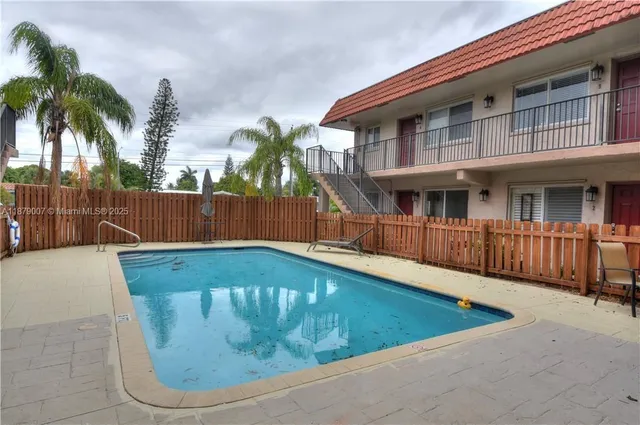 a view of a swimming pool with a porch