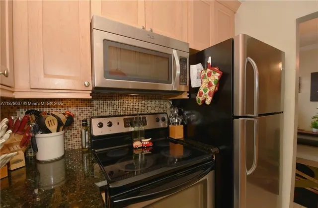 a kitchen with a stove and a microwave