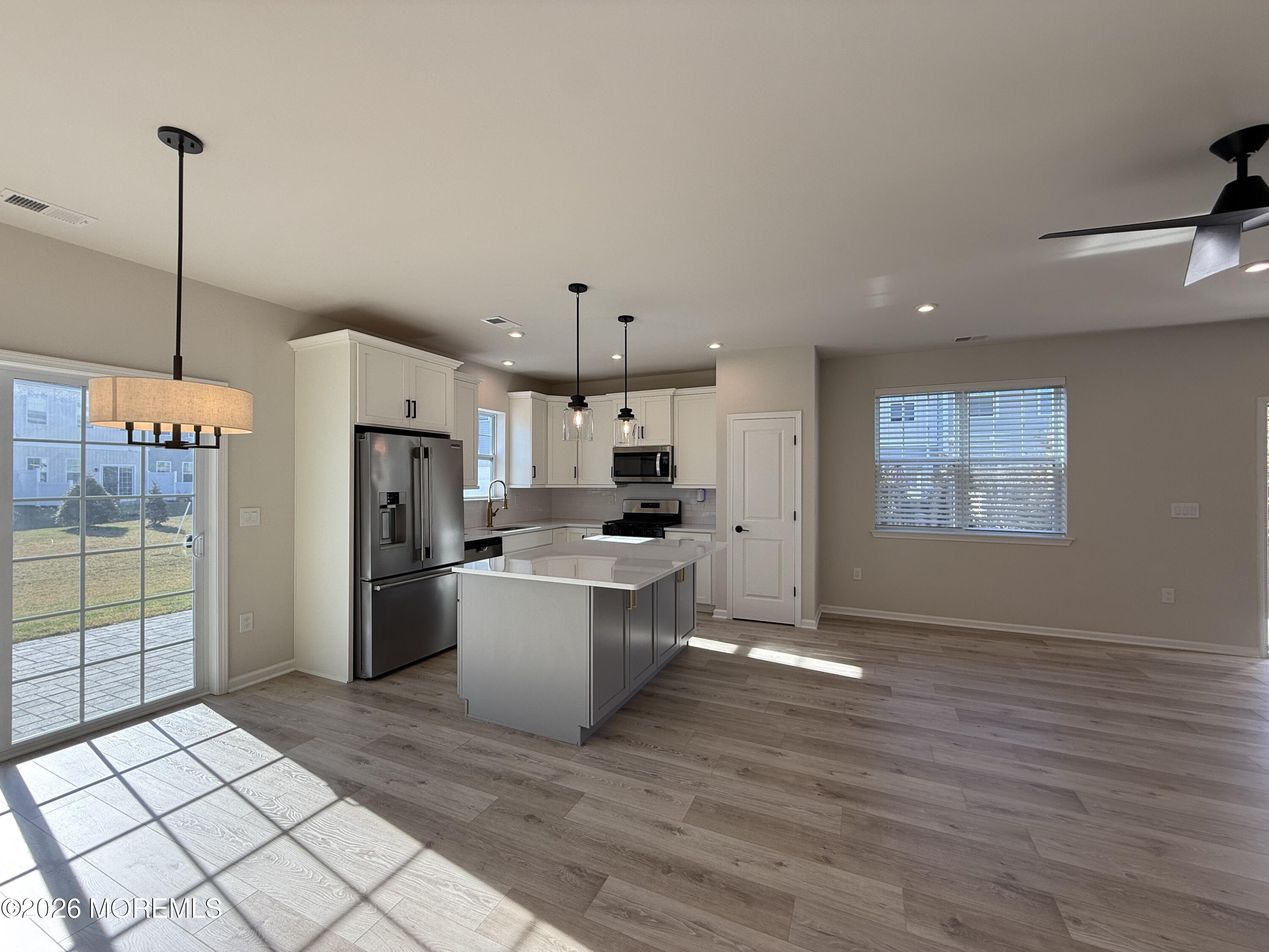 20 Laird Way Neptune, NJ 07753 - Photo 12 of 32 a kitchen with refrigerator and cabinets