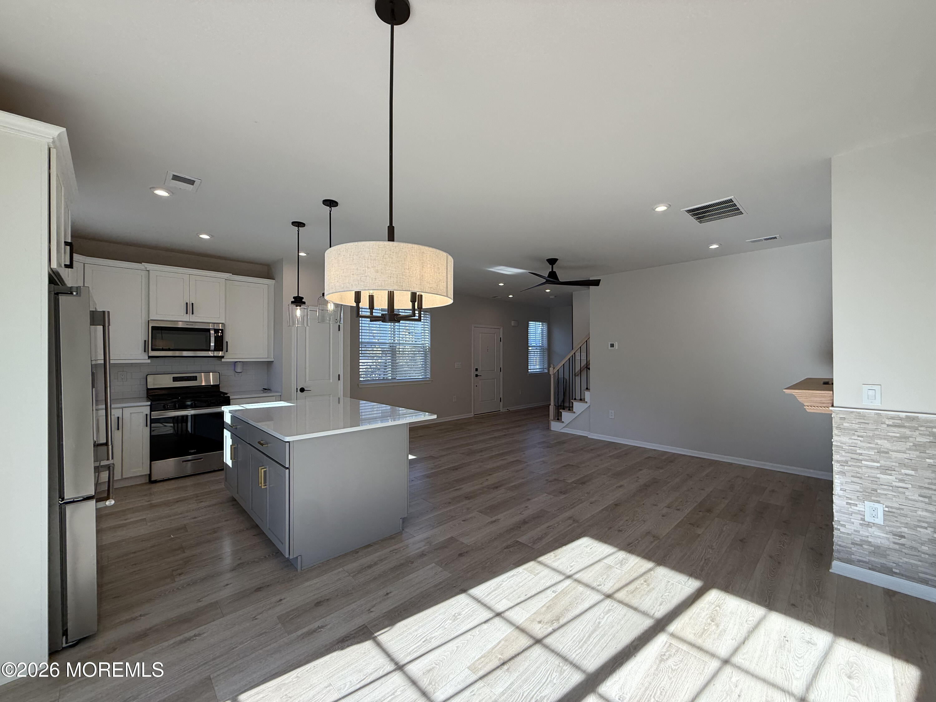 20 Laird Way Neptune, NJ 07753 - Photo 13 of 32 a view of kitchen and hall with wooden floor