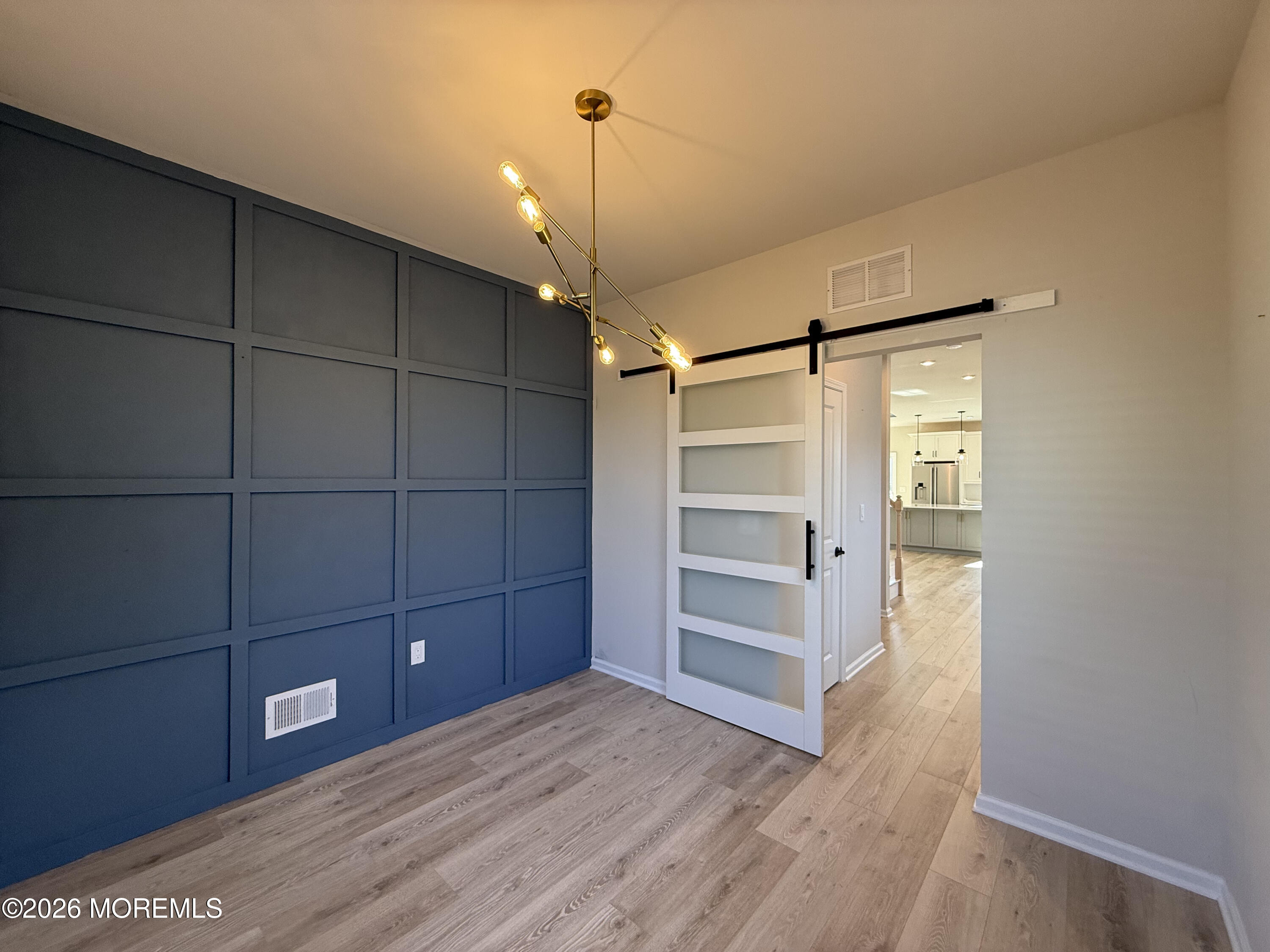 20 Laird Way Neptune, NJ 07753 - Photo 18 of 32 a view of an empty room and wooden floor
