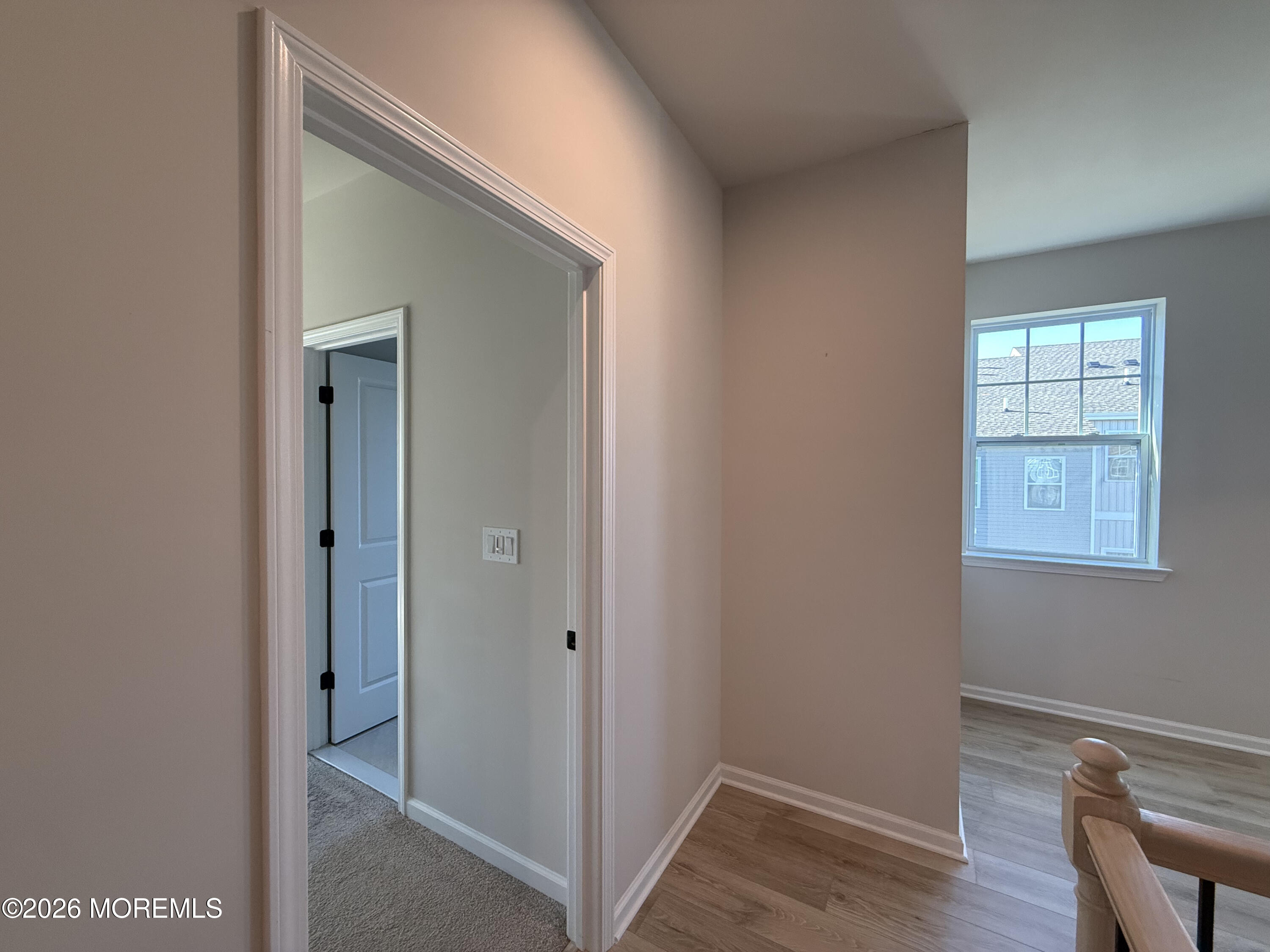 20 Laird Way Neptune, NJ 07753 - Photo 22 of 32 a view of a hallway with wooden floor and closet