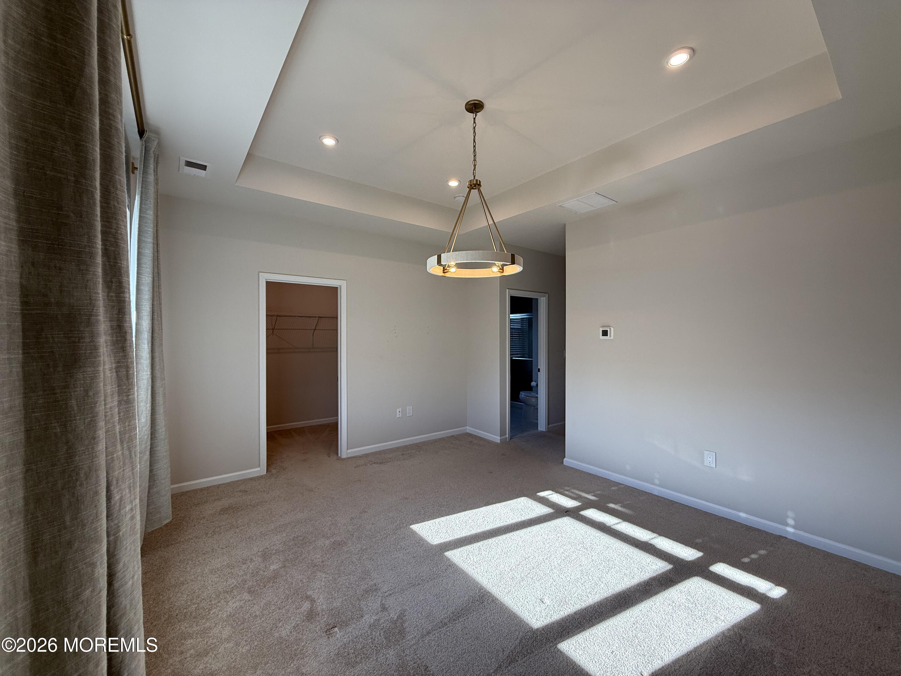 20 Laird Way Neptune, NJ 07753 - Photo 26 of 32 en empty room with windows and ceiling fan