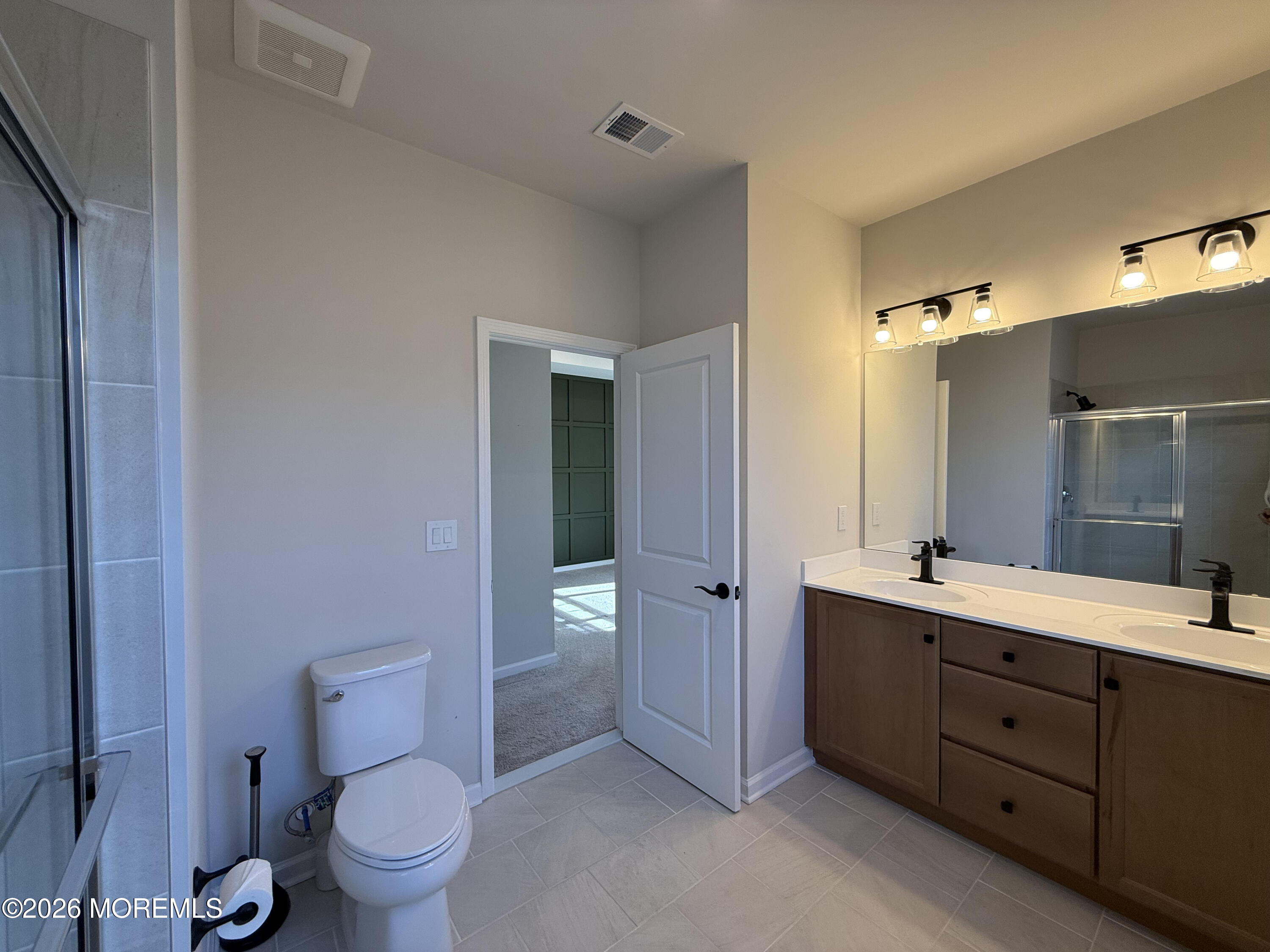 20 Laird Way Neptune, NJ 07753 - Photo 27 of 32 a spacious bathroom with a double vanity sink toilet and shower