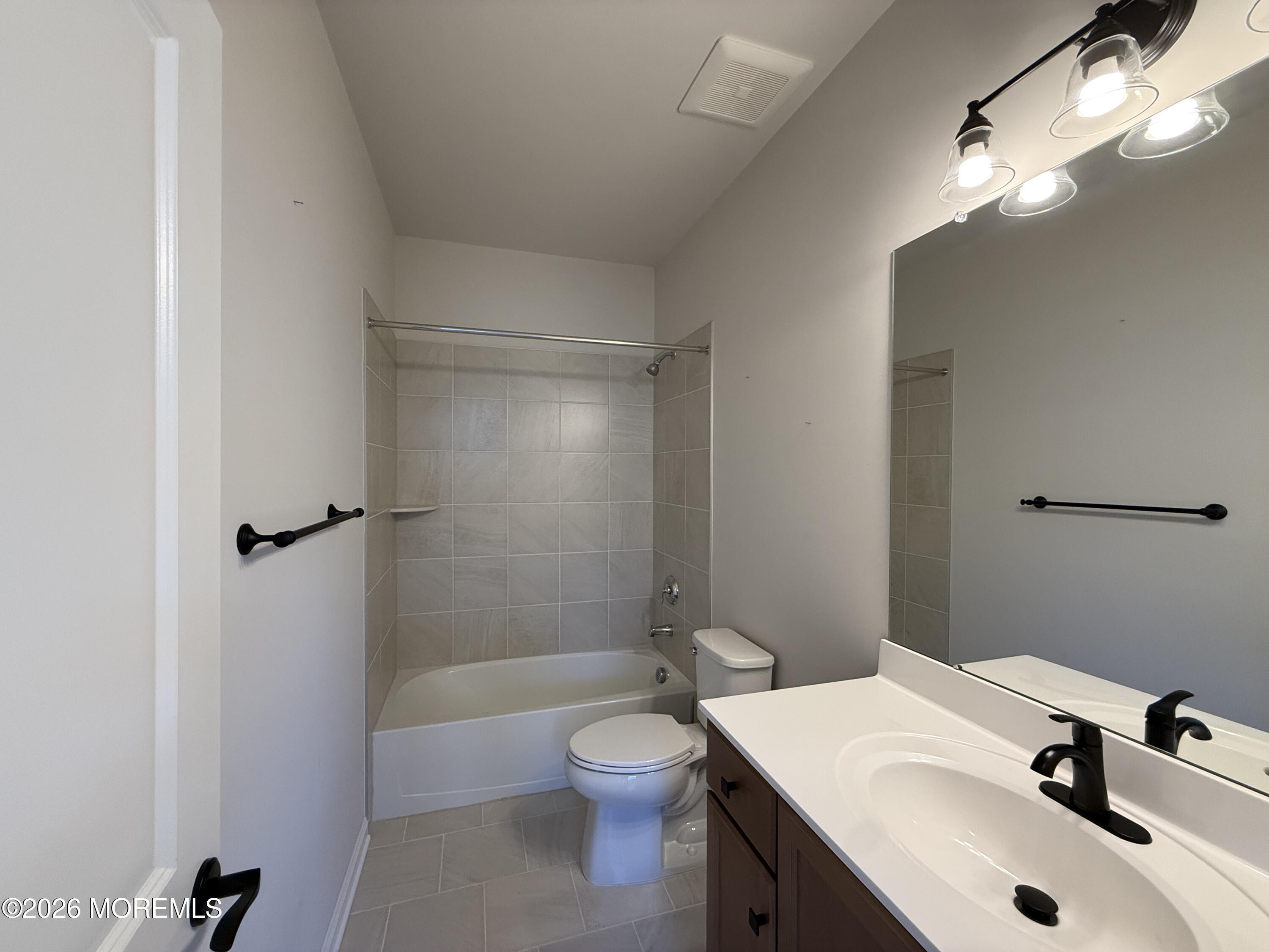 20 Laird Way Neptune, NJ 07753 - Photo 30 of 32 a bathroom with a sink toilet and shower