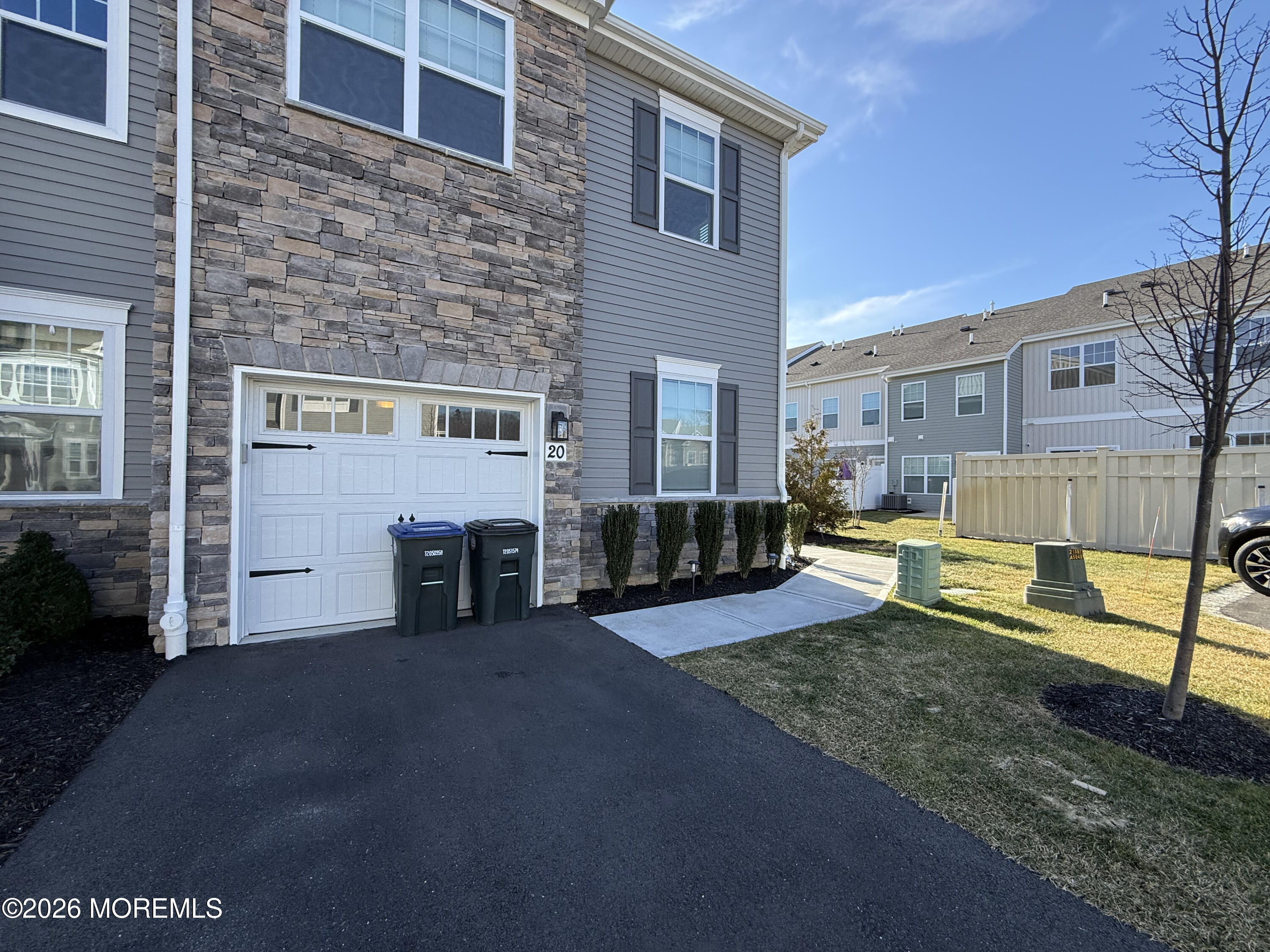 20 Laird Way Neptune, NJ 07753 - Photo 4 of 32 a view of a house with a fire pit and a yard