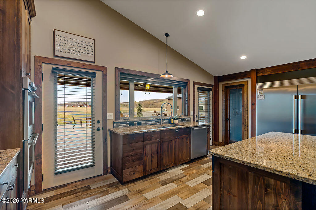 3344 Marks Road Yakima, WA 98903 - Photo 18 of 56 a kitchen with stainless steel appliances granite countertop a sink and wooden cabinets