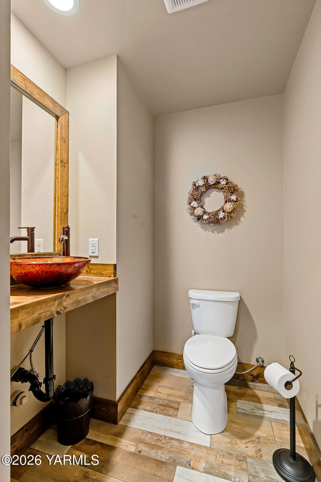3344 Marks Road Yakima, WA 98903 - Photo 32 of 56 a bathroom with a toilet a sink and a mirror