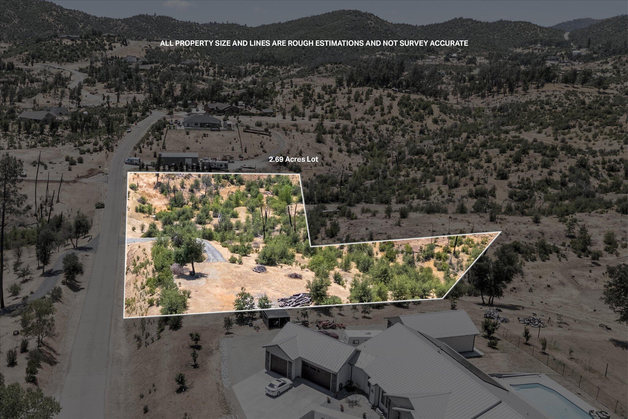 an aerial view of a residential houses with outdoor space