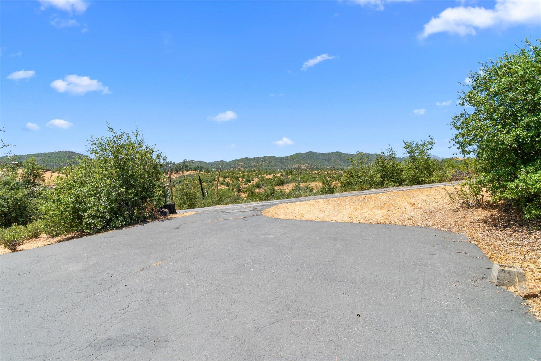10000 Tilton Mine Road Redding, CA 96001 - Photo 8 of 19 a view of a road with a yard