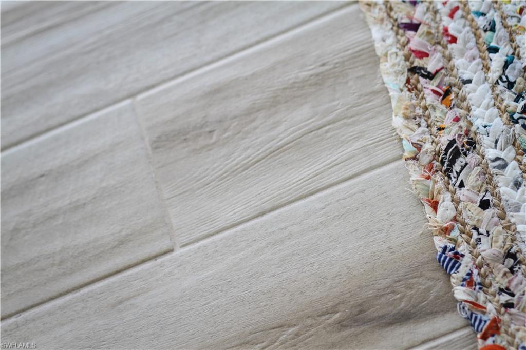 97 Georgetown Boulevard, Unit 97 Naples, FL 34112 - Photo 12 of 26 a bathroom with a shower curtain