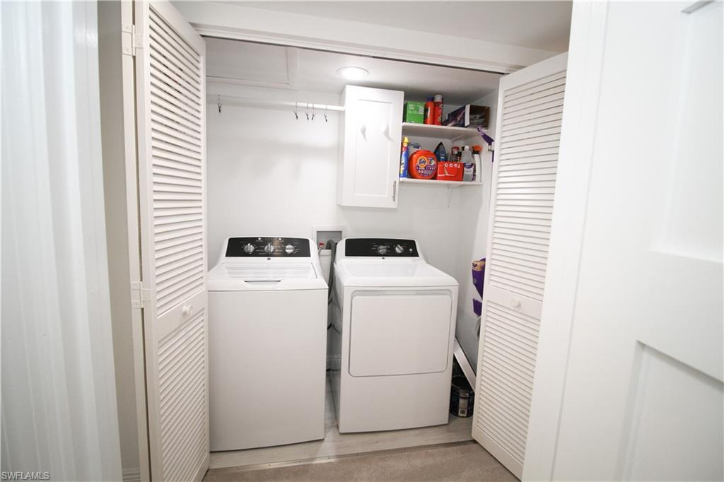 97 Georgetown Boulevard, Unit 97 Naples, FL 34112 - Photo 25 of 26 a utility room with dryer and washer