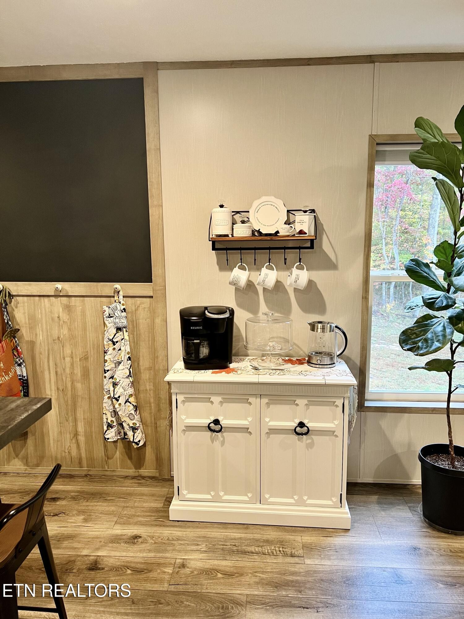 186 Perkins Trail Deer Lodge, TN 37726 - Photo 34 of 54 a kitchen with a stove and a potted plant